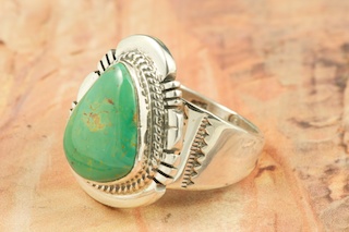 Genuine Crow Springs Turquoise set in Sterling Silver Ring. The Crow Springs Mine is located near Tonopah, Nevada. Created by Navajo Artist John Nelson. Signed.